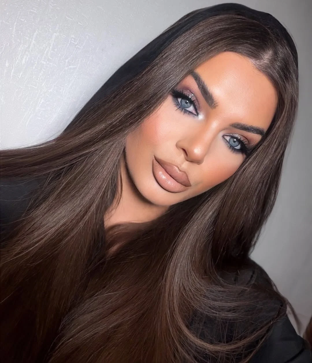 warm summer brunette hair color 2026 Silky neutral brunette with glass shine finish