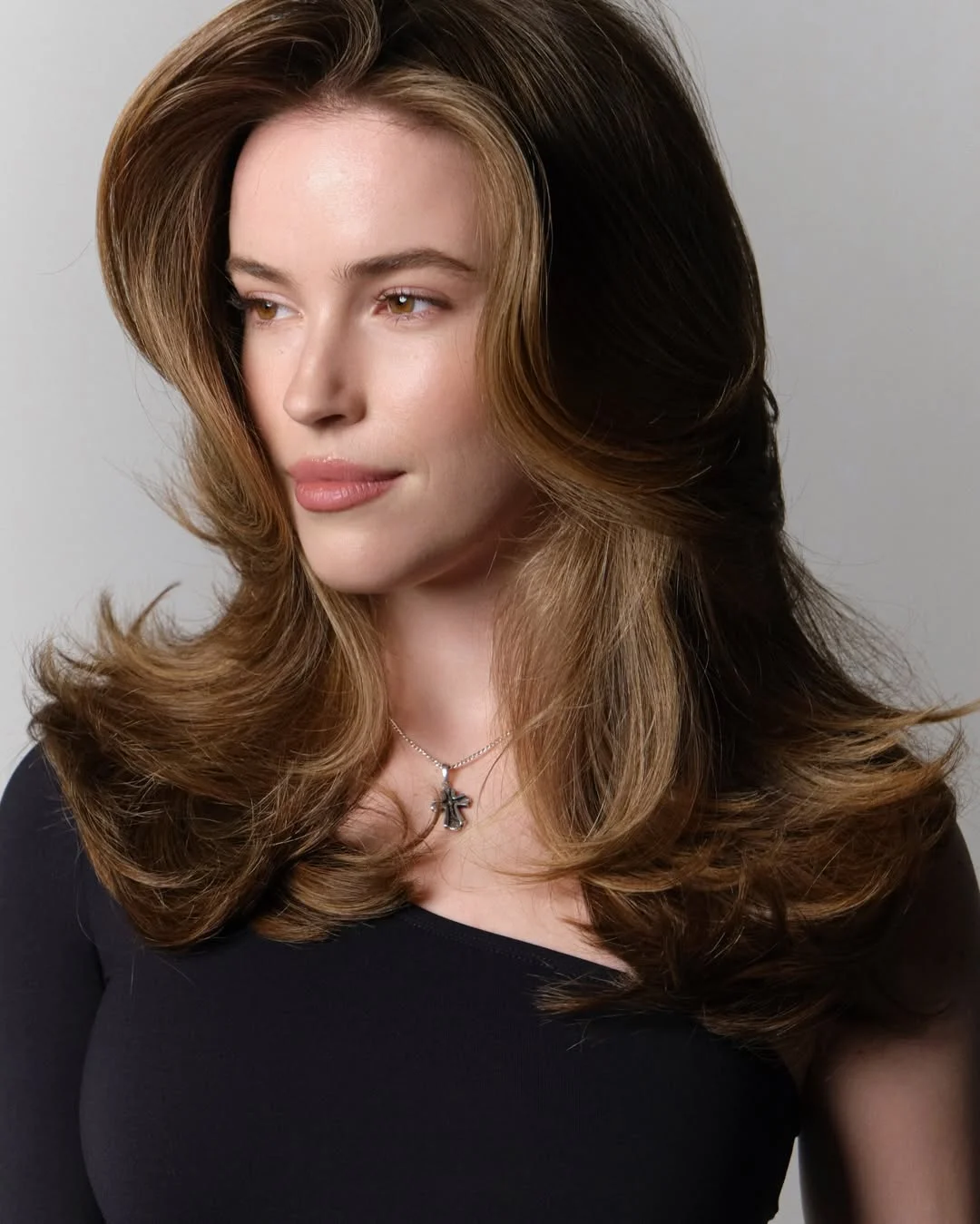 warm summer brunette hair color 2026 Golden brunette blend with light face framing contrast