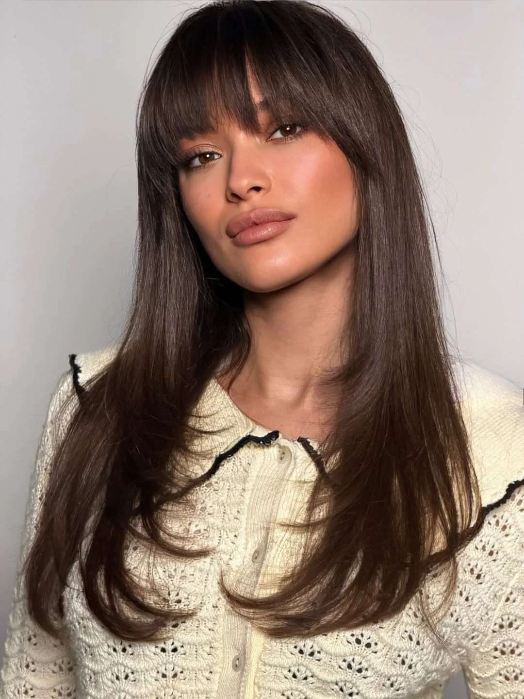 warm summer brunette hair color 2026 Teddy Bear Brunette with Soft Fringe Energy