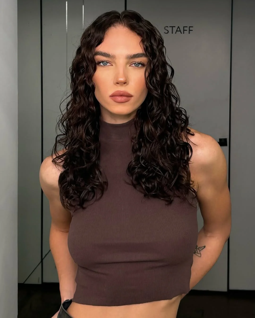warm summer brunette hair color 2026 Glossy Dark Brunette with Natural Curly Definition