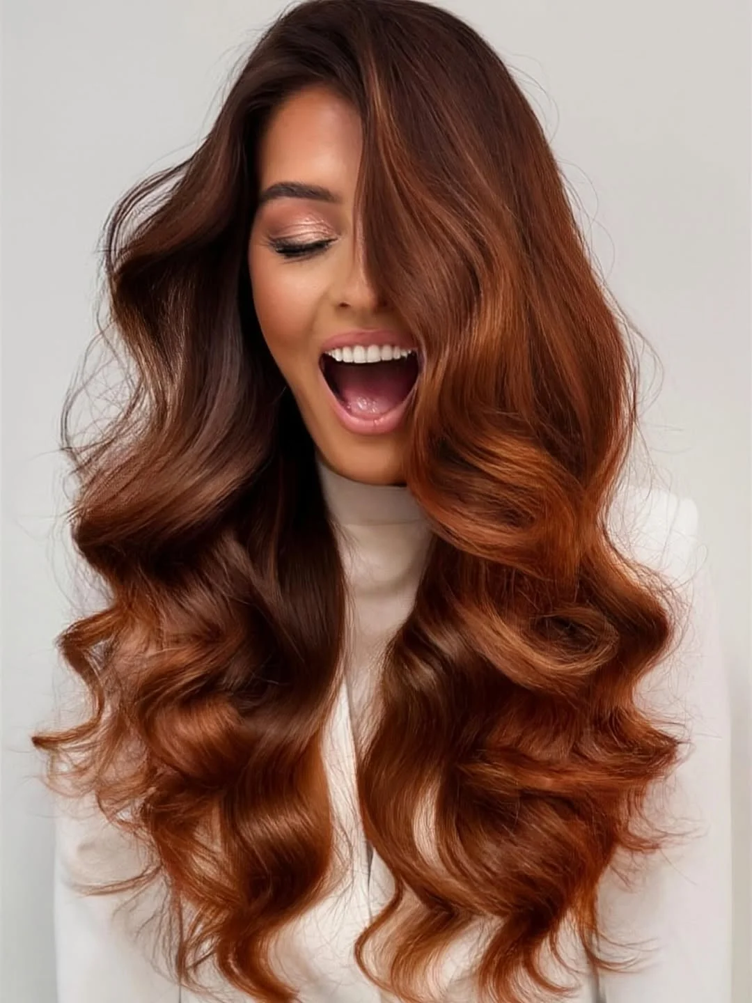 warm summer hair color for dark skin 2026 Glossy Auburn Waves with Statement Shine