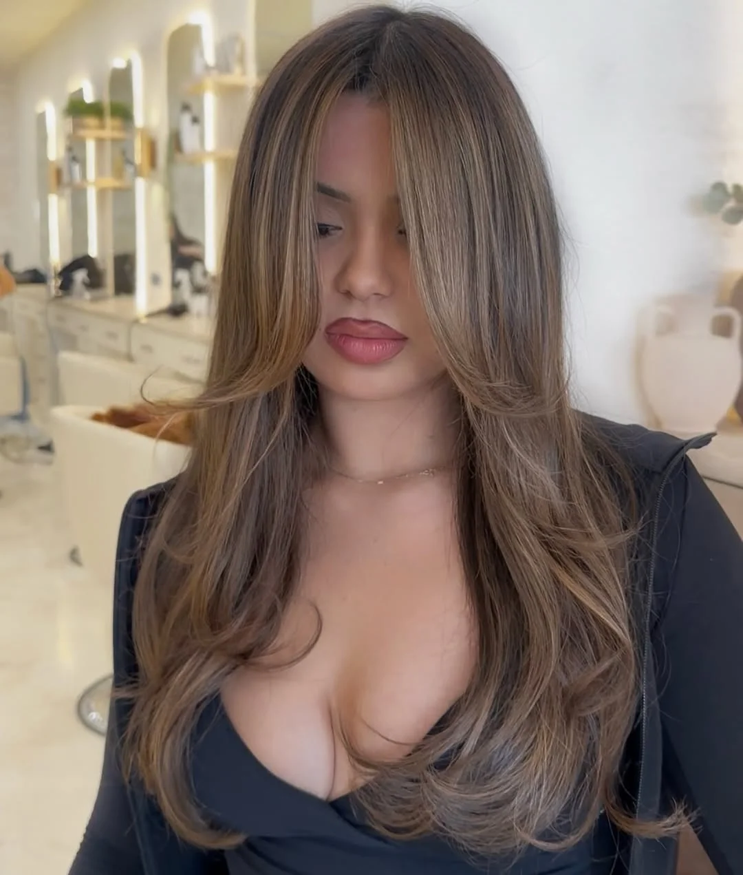 warm summer hair color for dark skin 2026 Soft Ash Brown Layers with Face Framing Light