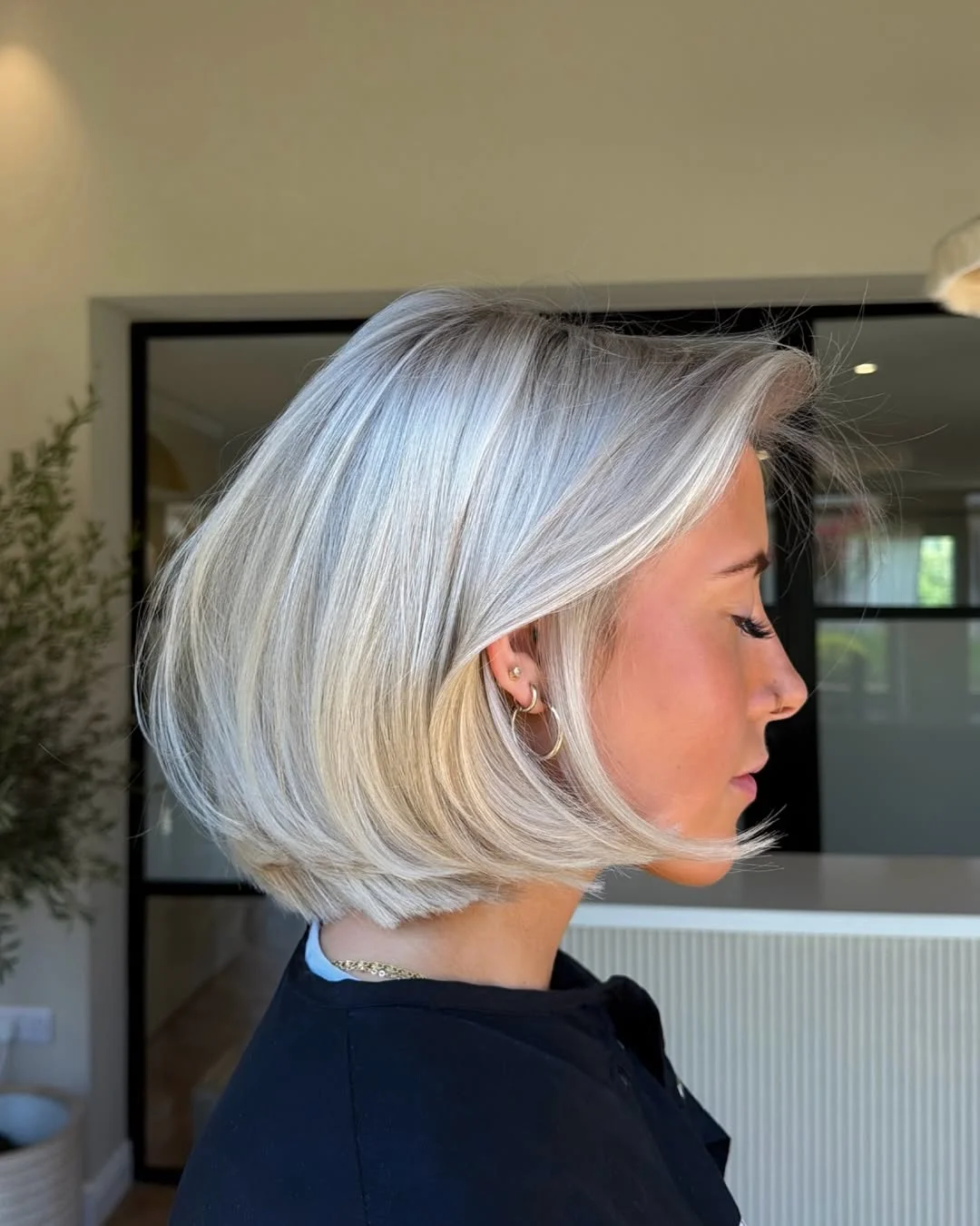 warm summer hair color for tan skin 2026 Short Icy Blonde Bob with Sculpted Shine