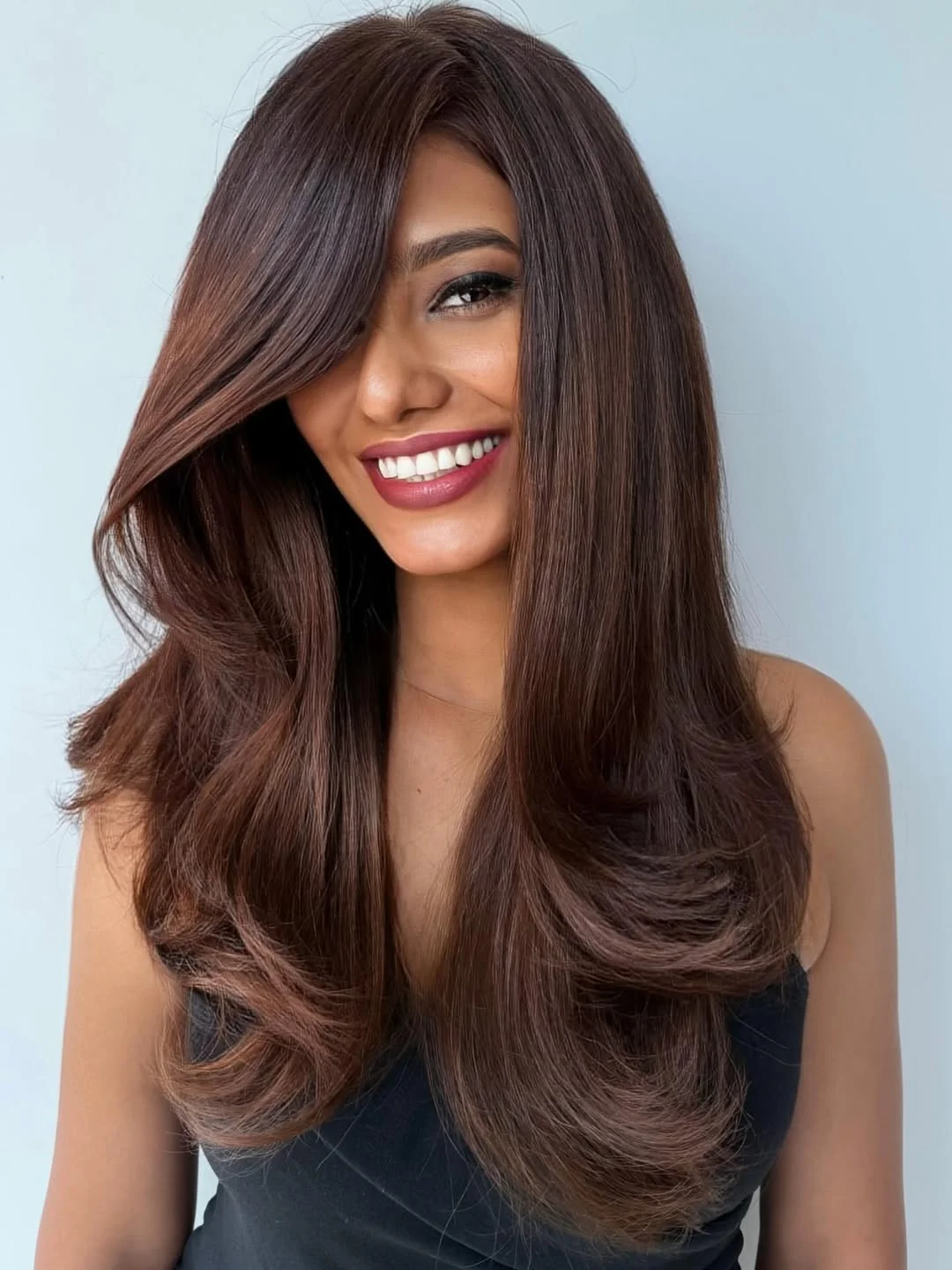 warm summer hair color for tan skin 2026 Deep Chocolate Layers with Glossy Volume