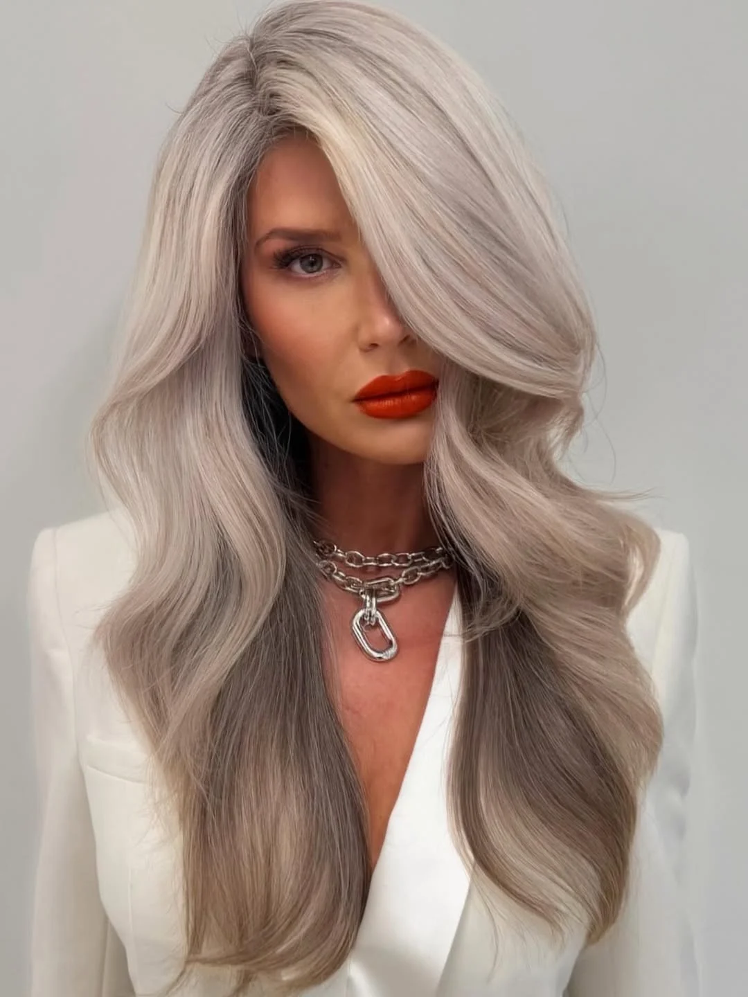 warm summer hair color for tan skin 2026 Cool Pearl Blonde with Glossy Definition