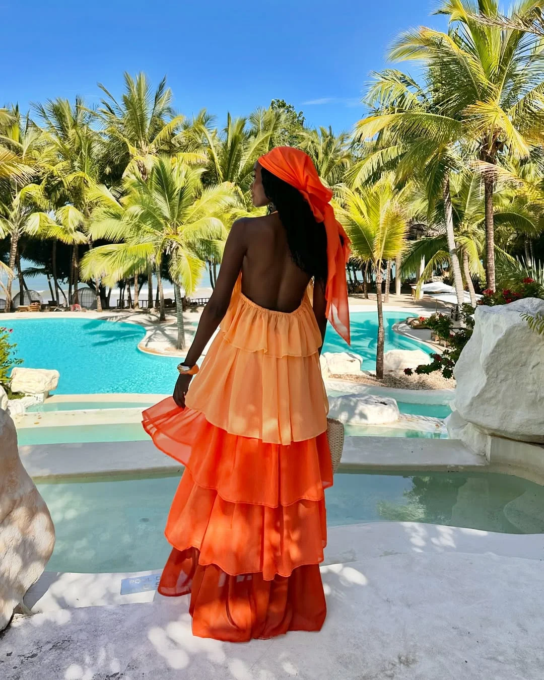 chic early summer outfits 2026 Sunset Coral Layers for a Tropical Escape