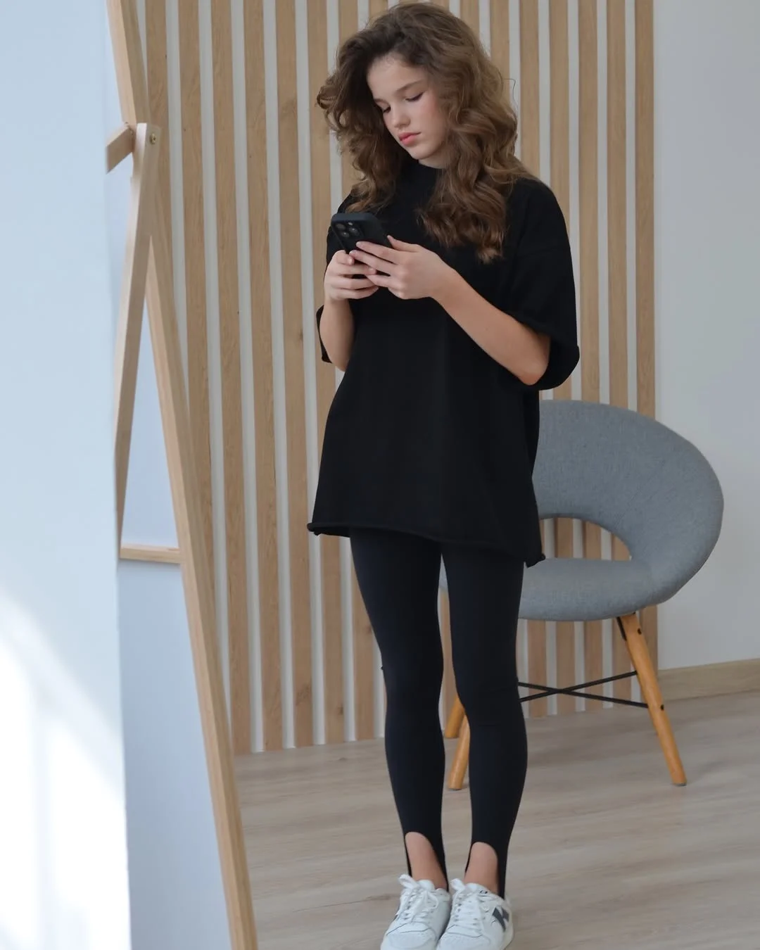 chic fall outfits with leggings and sneakers 2026 The Oversized T Shirt and Stirrup Leggings Combo