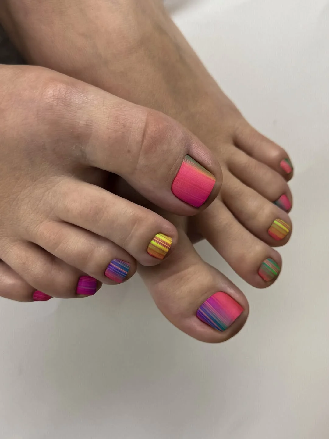 chic summer toe nails design ideas 2026 Bright Rainbow Stripe Pedicure