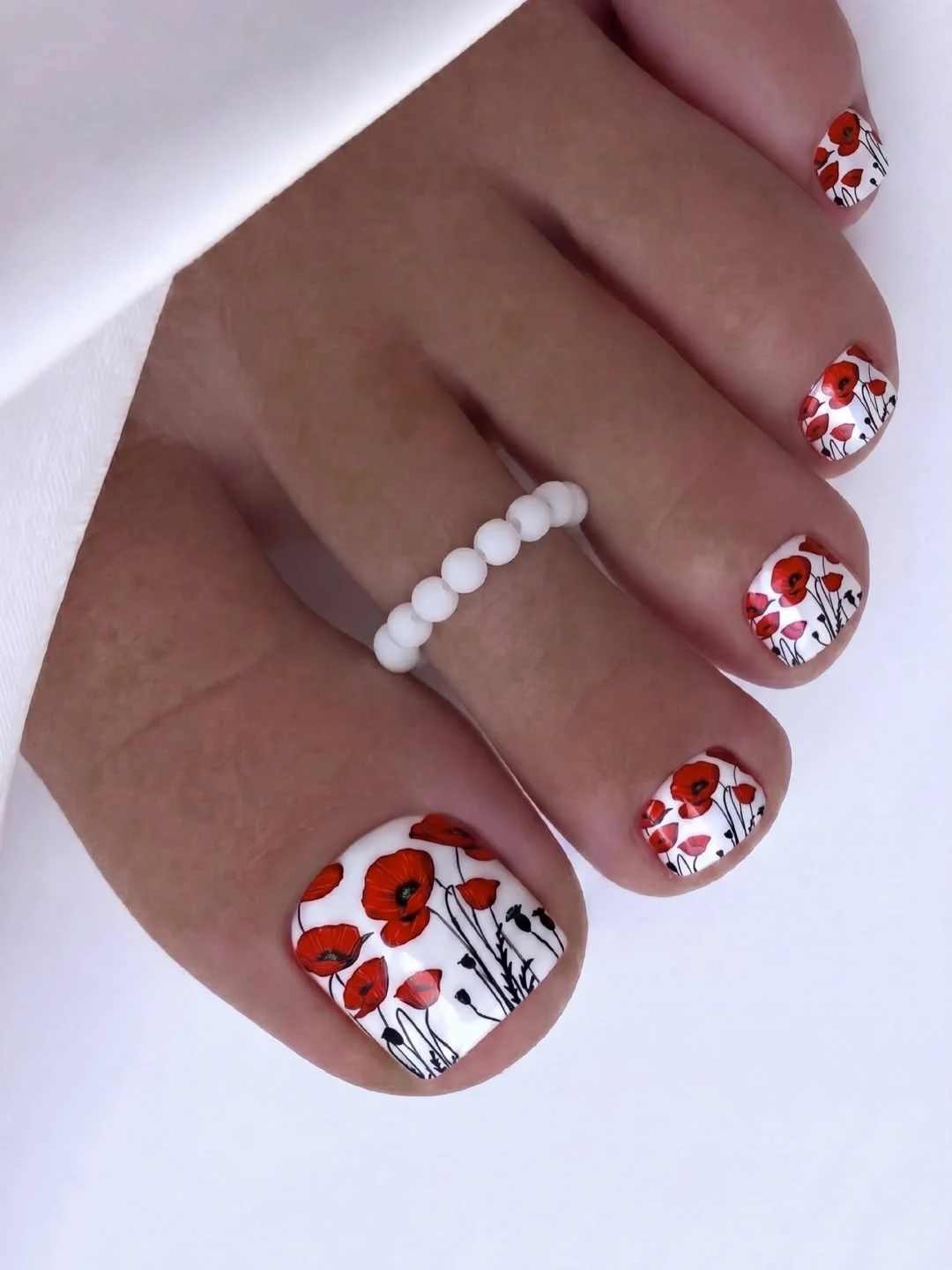 chic summer toe nails design ideas 2026 Red Poppy Garden on Crisp White