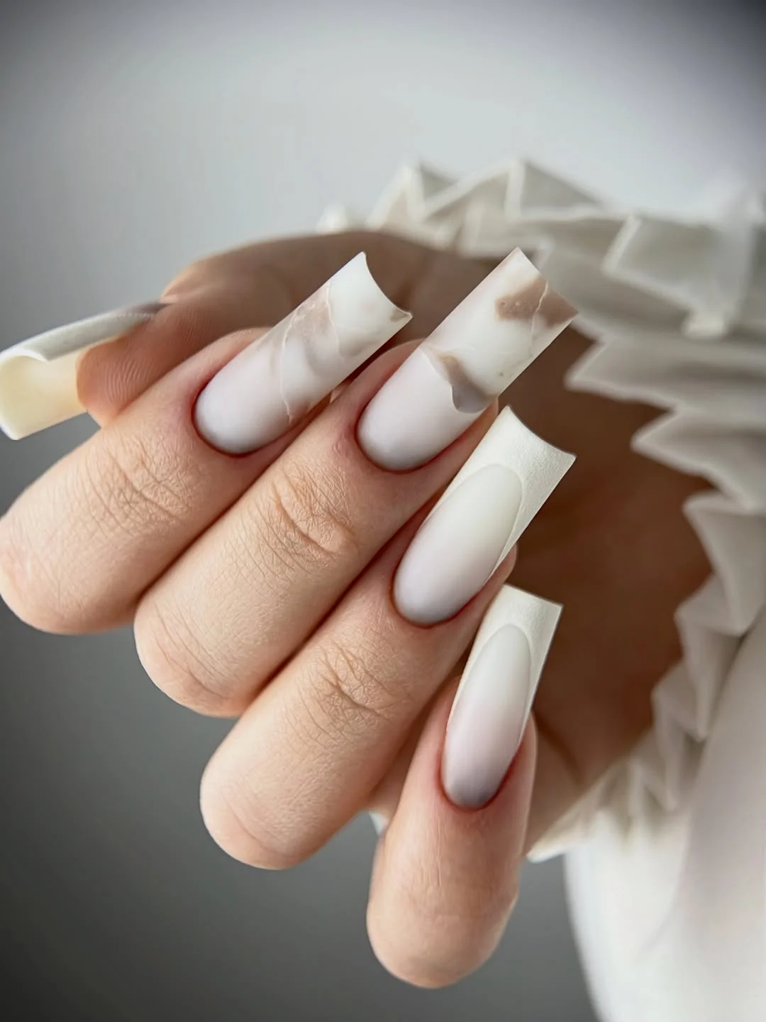 cool july nail colours ideas 2026 Soft White Marble Statement Nails