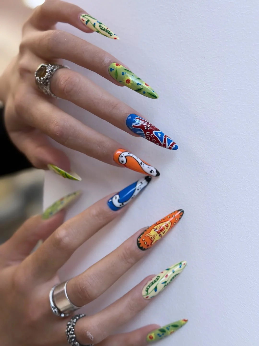 cool july nail colours ideas 2026 Eclectic Folk Art Statement Nails