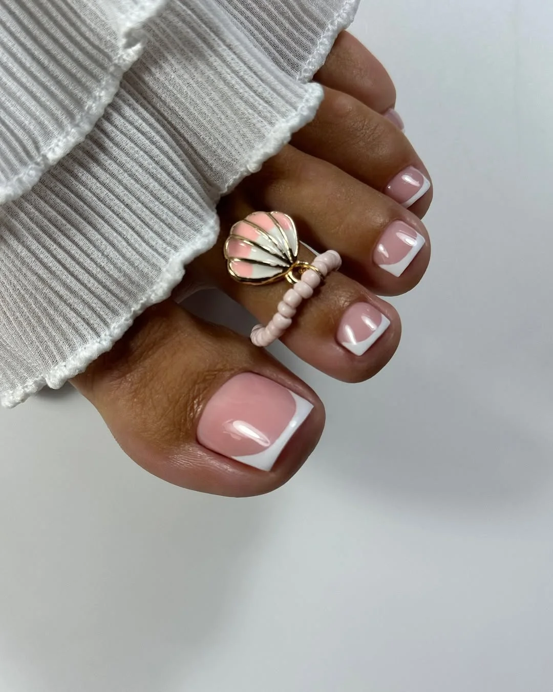 cute summer white french toes 2026 Glossy Pink French Pedicure With Coastal Charm