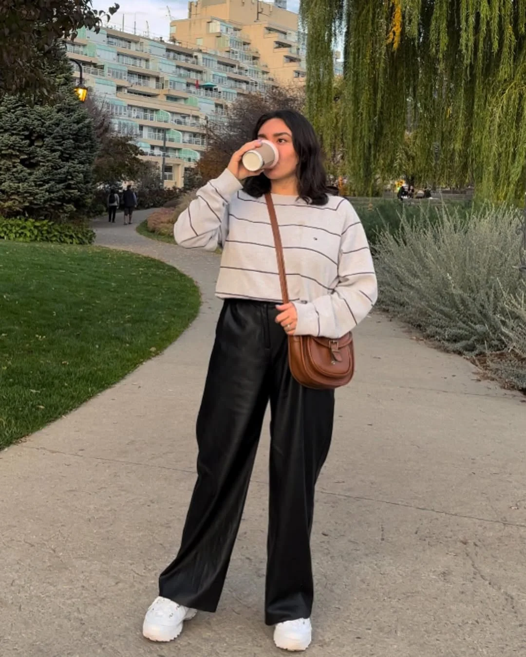 fall travel outfits with sneakers 2026 Leather Trousers and Coffee Walks at Sunset
