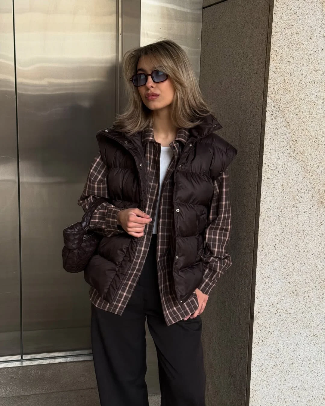 fashionable fall outfits with vests 2026 Dark Plaid Layers with a Glossy Puffer Vest