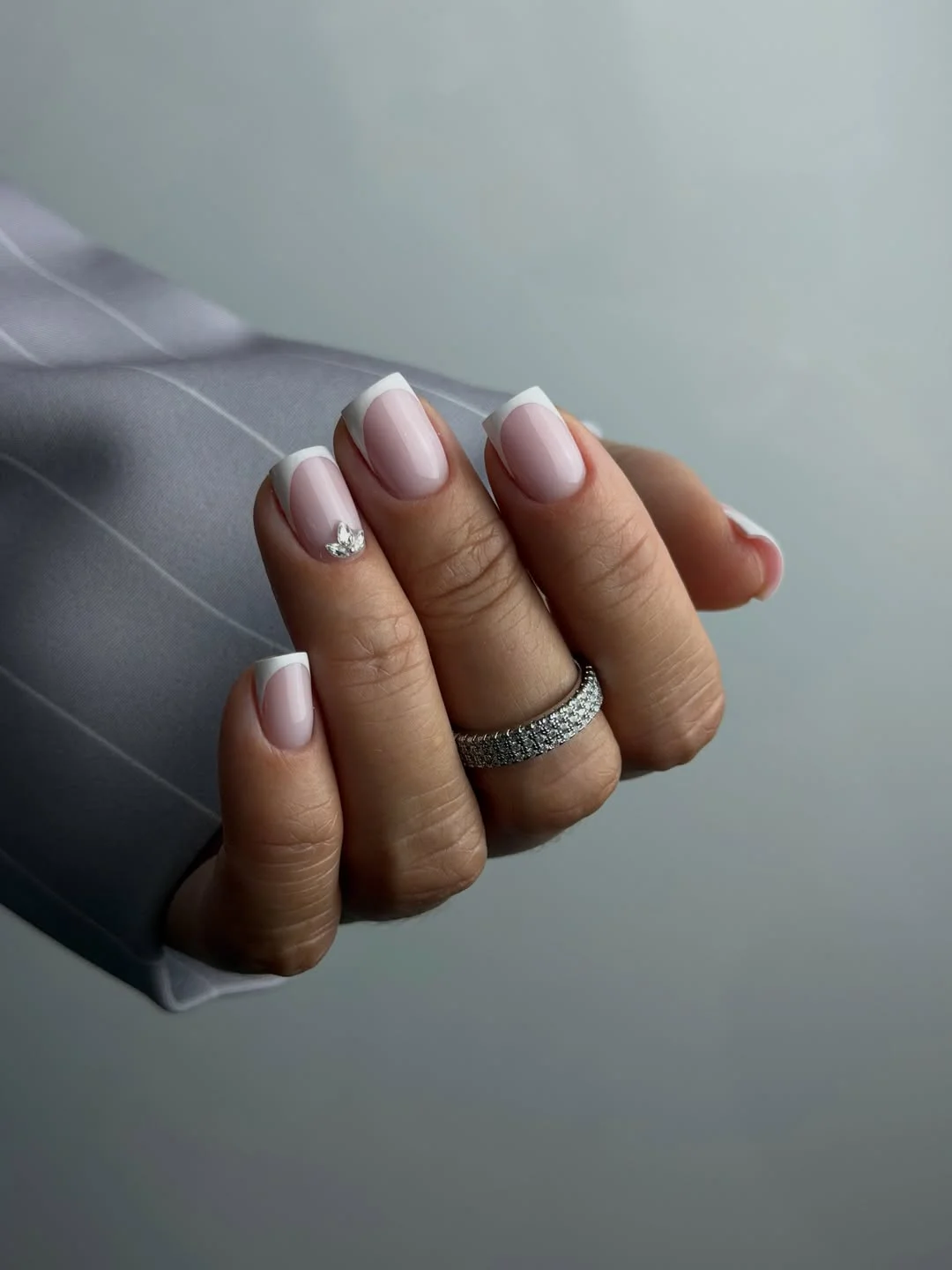 modern june manicure ideas 2026 Modern French Tips with a Touch of Sparkle