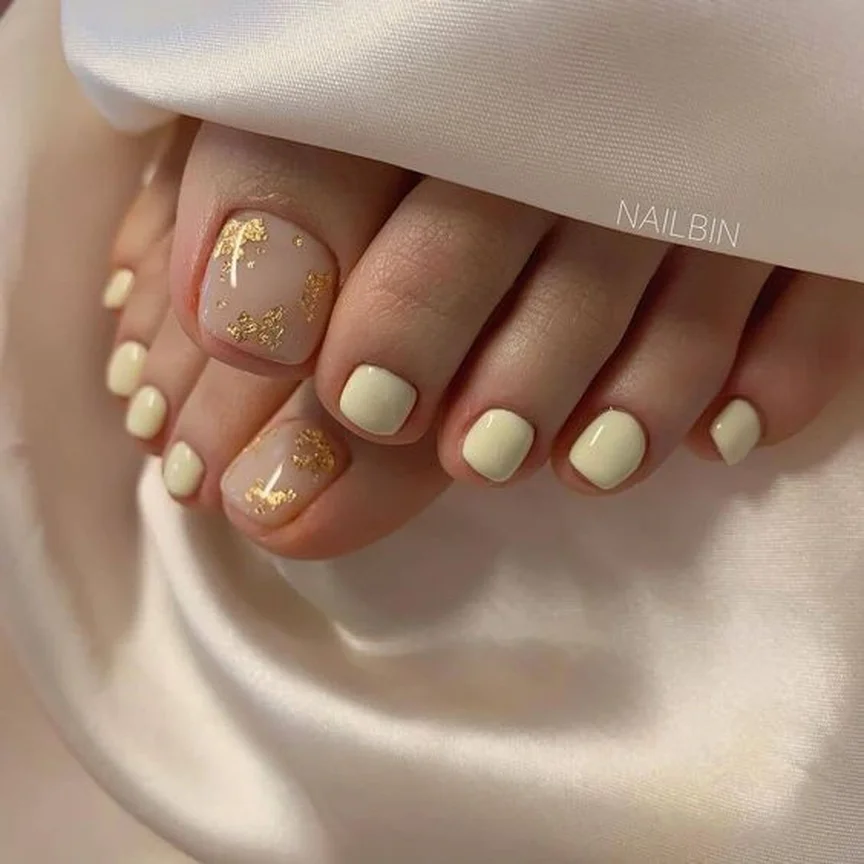 modern summer pedicure nail art 2026 Soft Ivory And Gold Foil Elegance