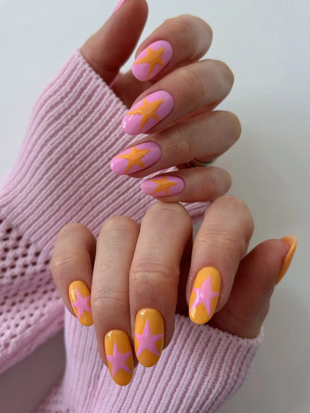 pretty july nails design ideas 2026 Retro Star Nails in Candy Pink and Apricot
