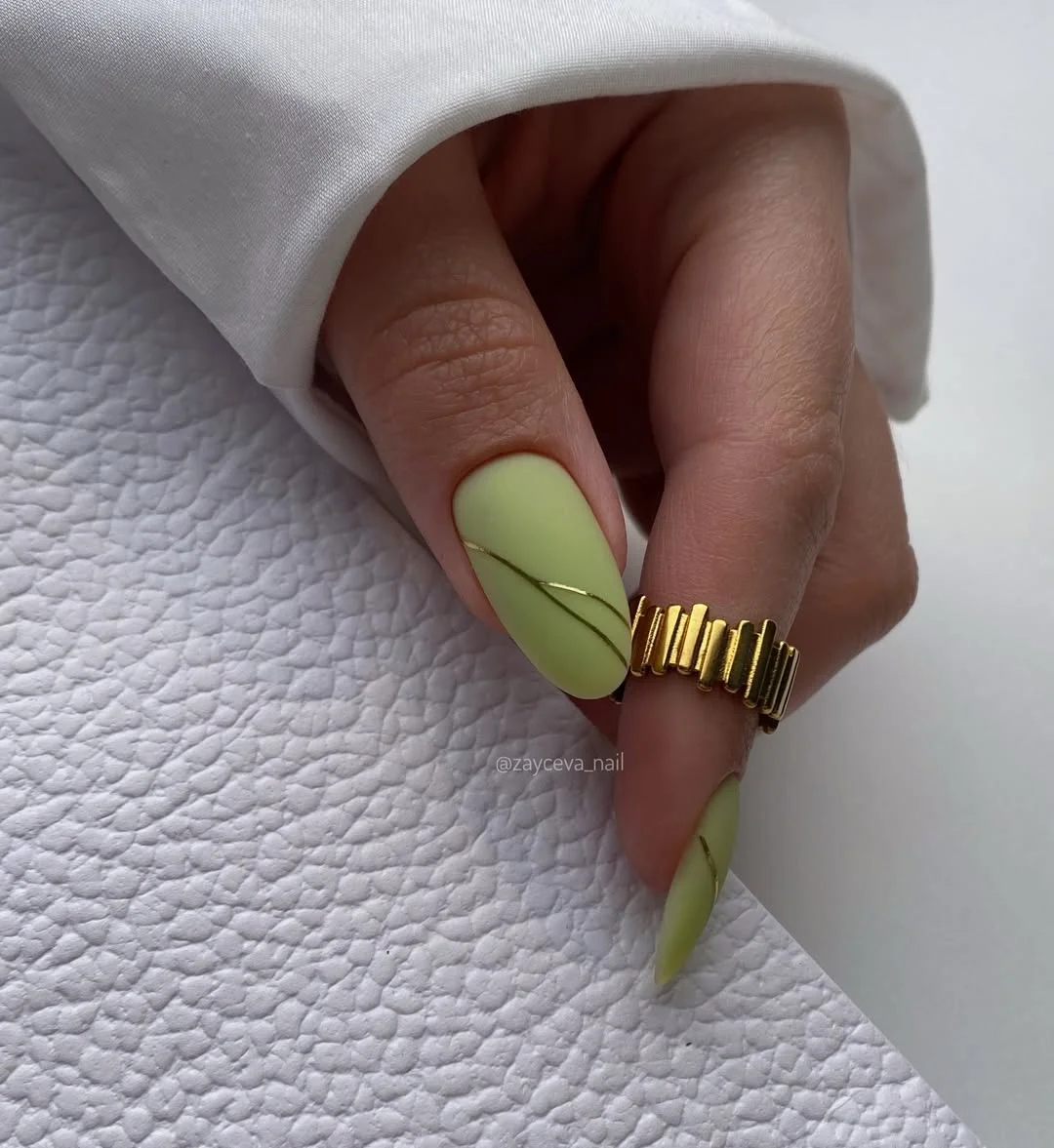 pretty july nails design ideas 2026 Soft Pistachio Green Nails with Minimal Gold Lines