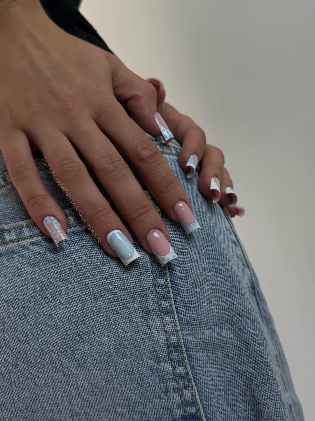 pretty july nails design ideas 2026 Baby Blue French Tips with Delicate Summer Patterns