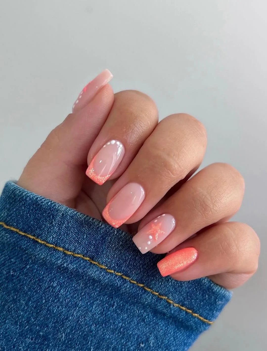 pretty starfish summer nails 2026 Coral Orange Square Nails With Subtle Beach Sparkle