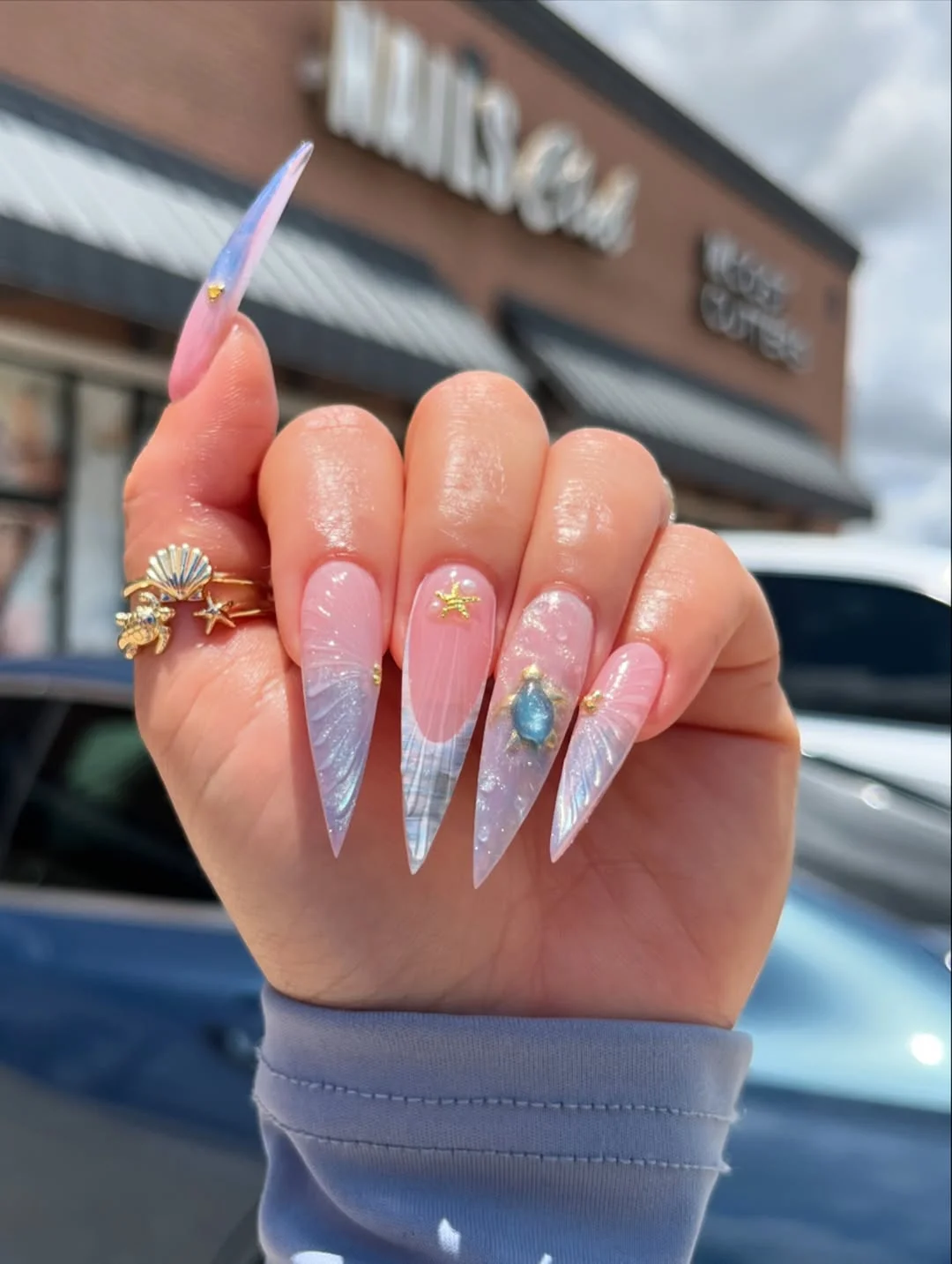 pretty starfish summer nails 2026 Mermaid-Inspired Stiletto Nails With Silver Ocean Shine