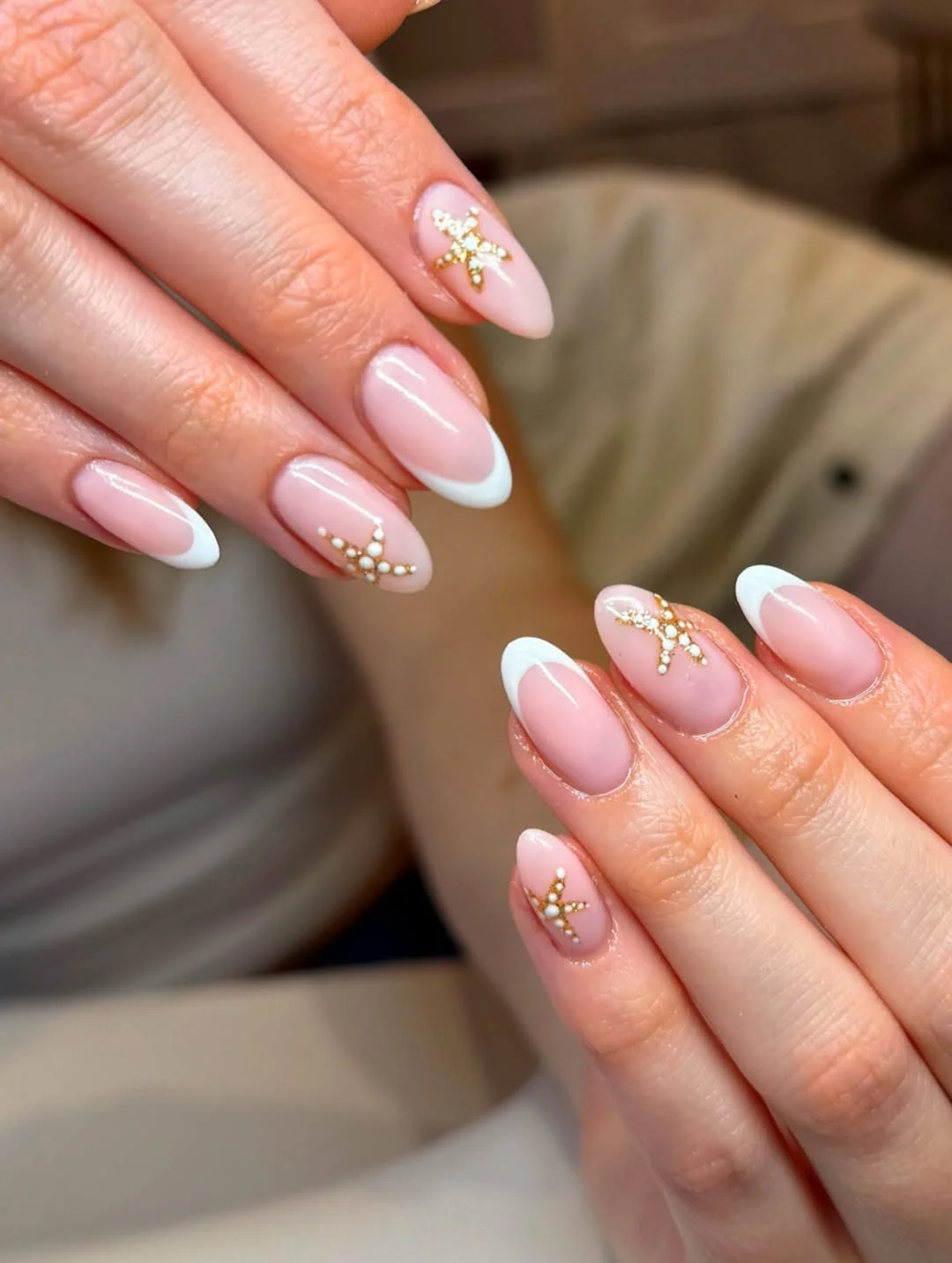 pretty starfish summer nails 2026 Elegant White French Tips With Gold Starfish Accents