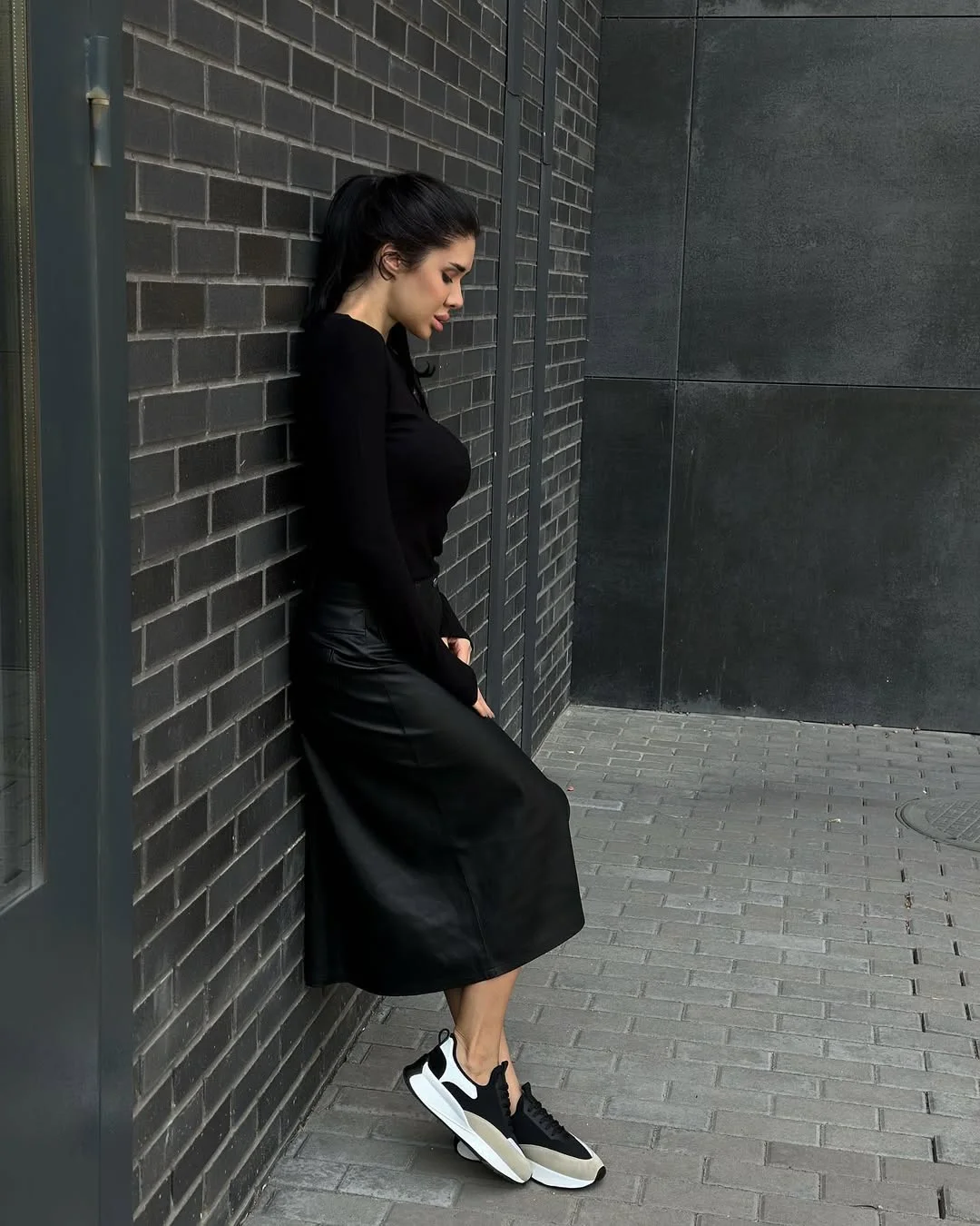 trendy fall skirt and sneakers outfits 2026 Monochrome Black Elegance with Modern Sneakers