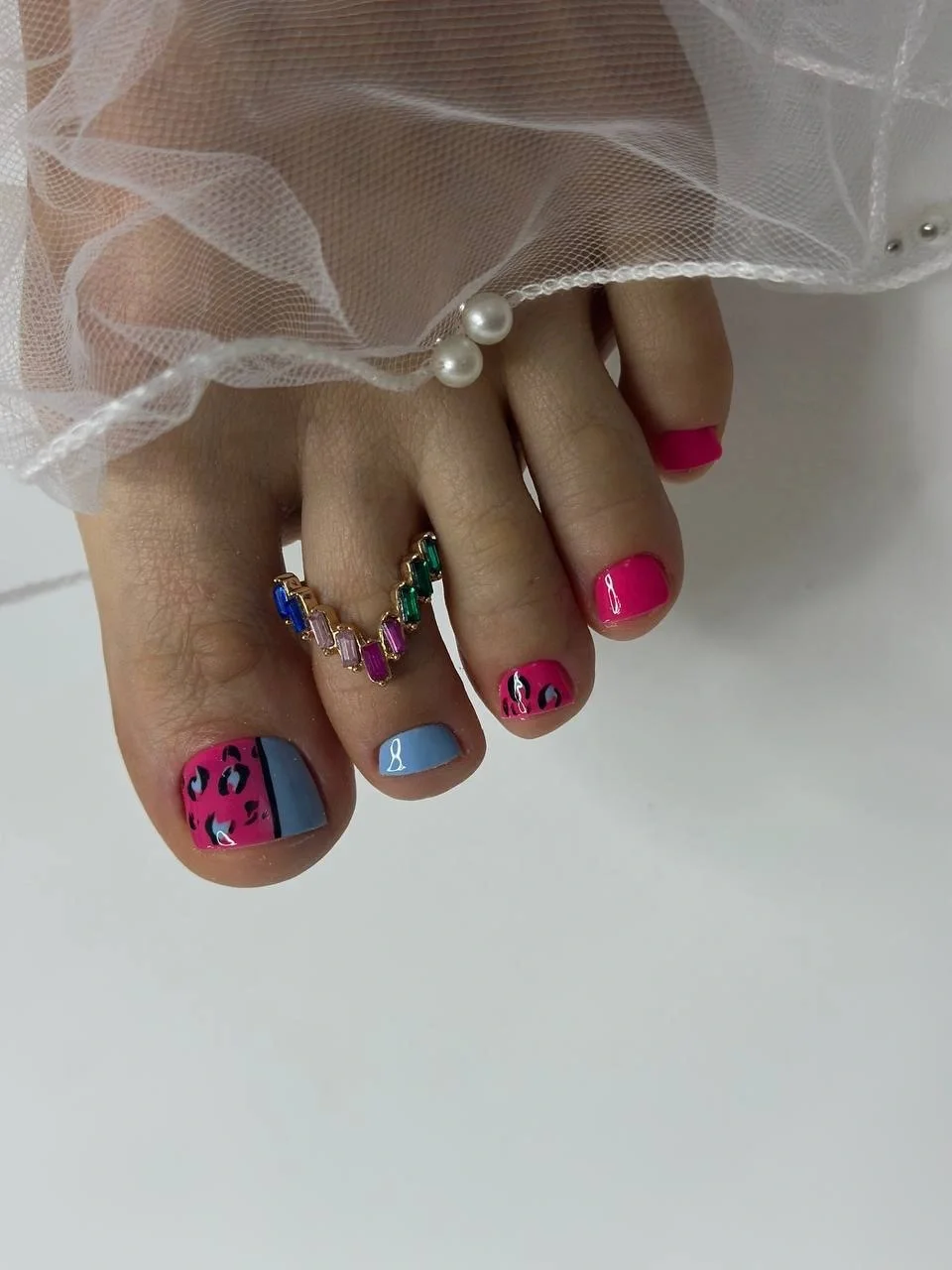 august pedicure nails ideas 2026 Pink And Blue Leopard Accent Pedicure