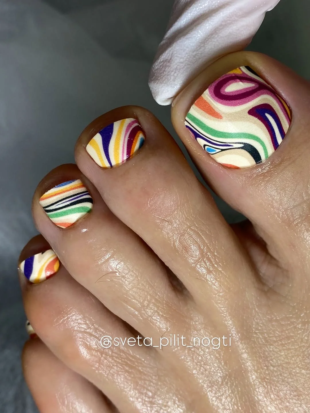 august pedicure nails ideas 2026 Retro Rainbow Swirl Pedicure