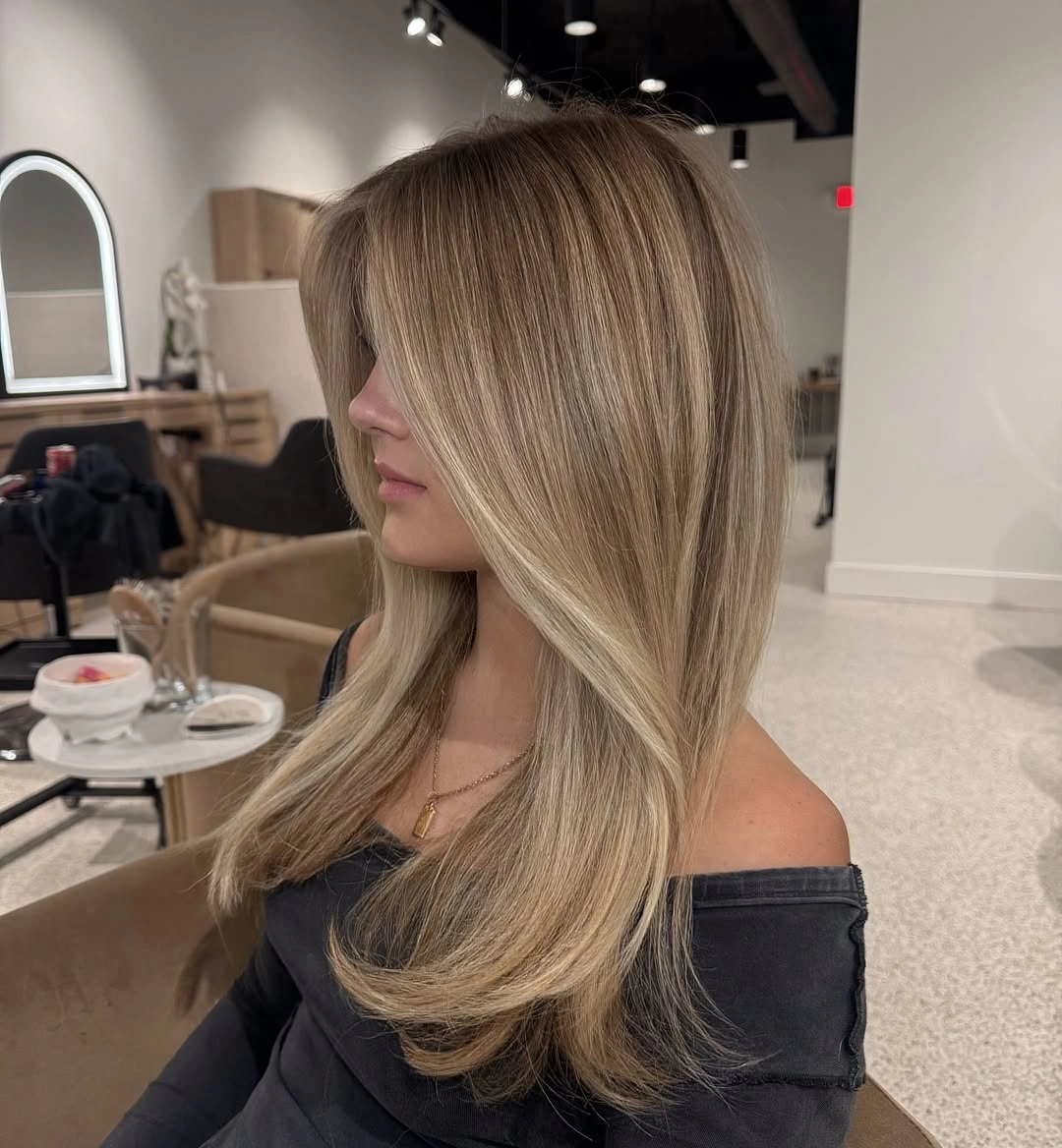 beautiful dirty blonde hair color Silky Beige Dirty Blonde With Luxurious Blowout Volume