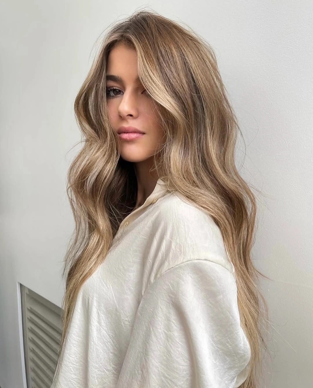 beautiful dirty blonde hair color Soft Wavy Dirty Blonde With Natural Dimension
