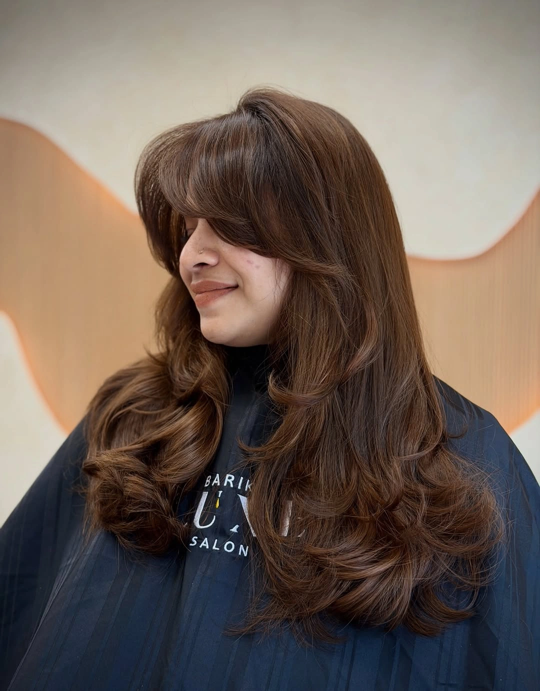 beautiful fall hair colour ideas 2026 Soft Chocolate Layers with Feathered Curtain Bangs