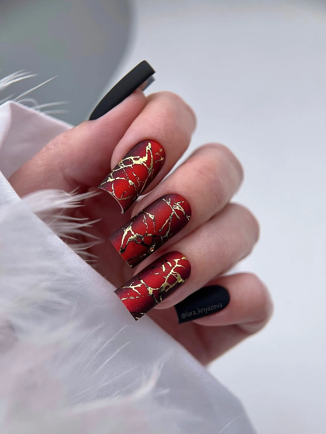 beautiful fall manicure 2026 Matte Crimson Marble With Gold Veining
