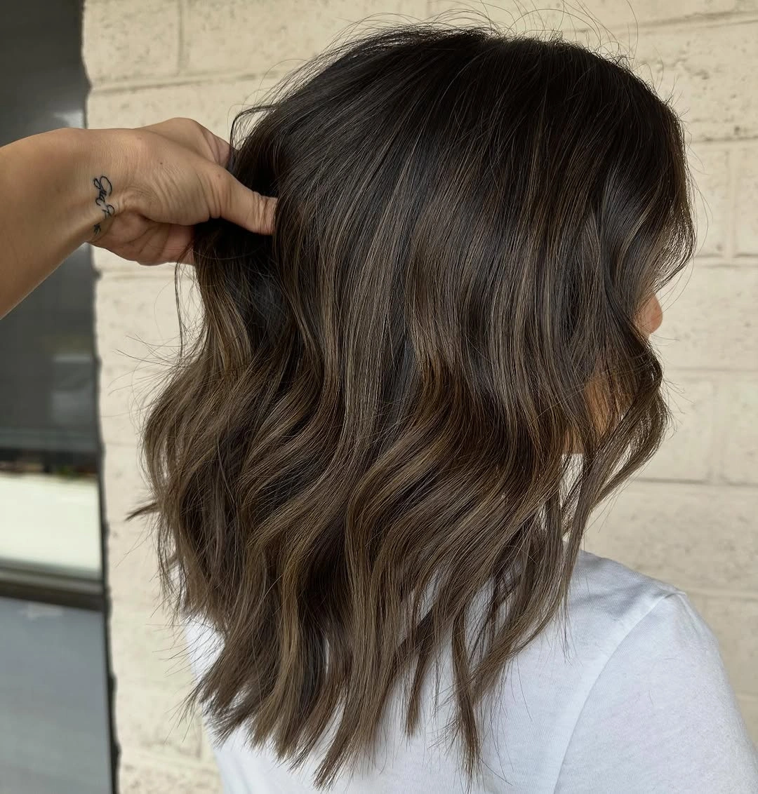 beautiful full head babylights blonde on brown hair Cool Brunette Waves With Barely-There Blonde Dimension