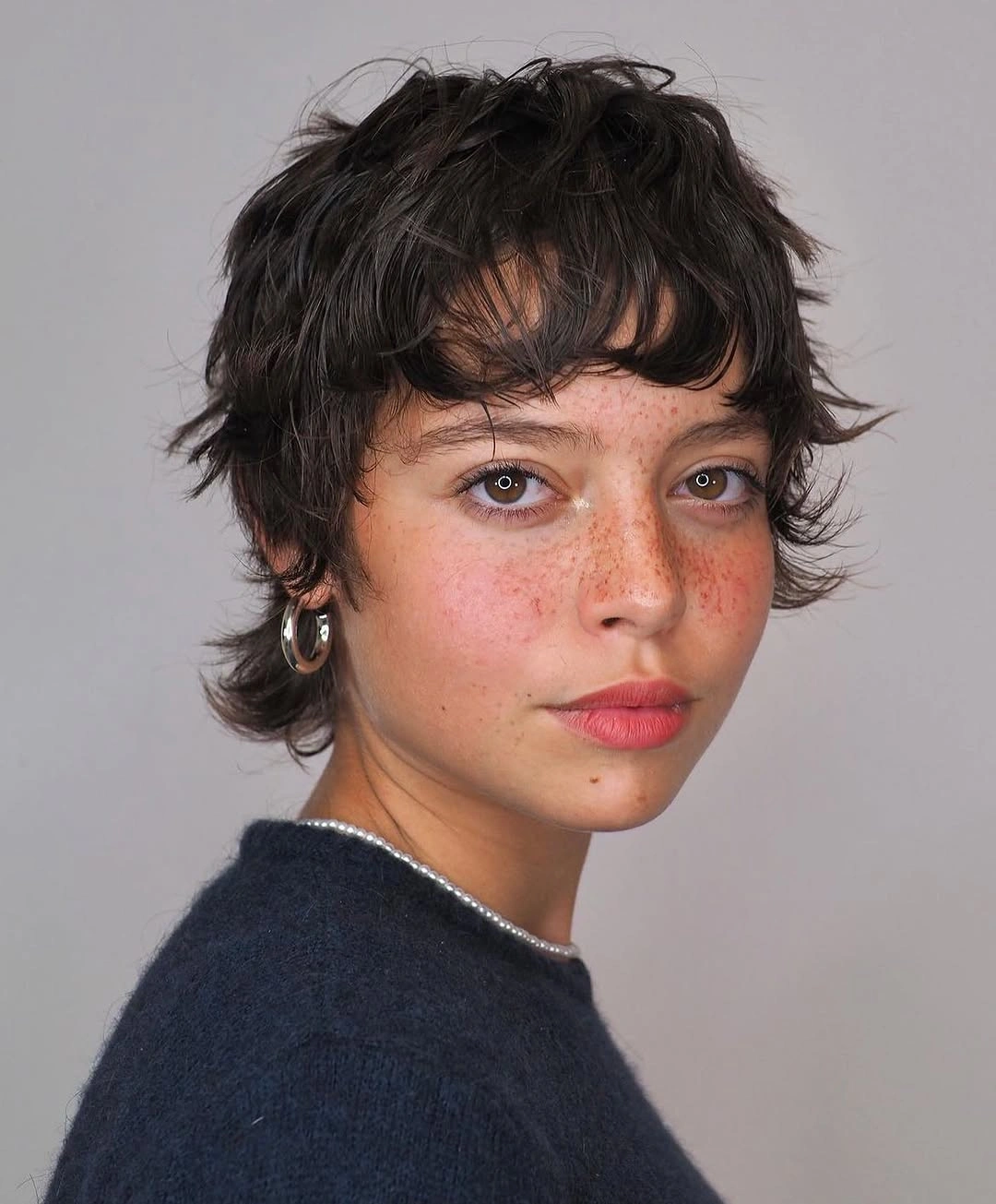 chic bixie haircut Soft Textured Chic with Feathered Movement