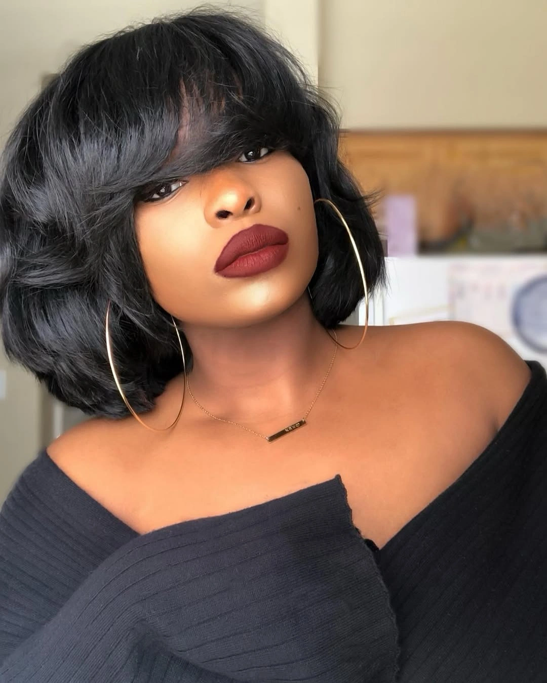 chic bob hairstyles for black women Voluminous Layered Bob With Dramatic Bangs