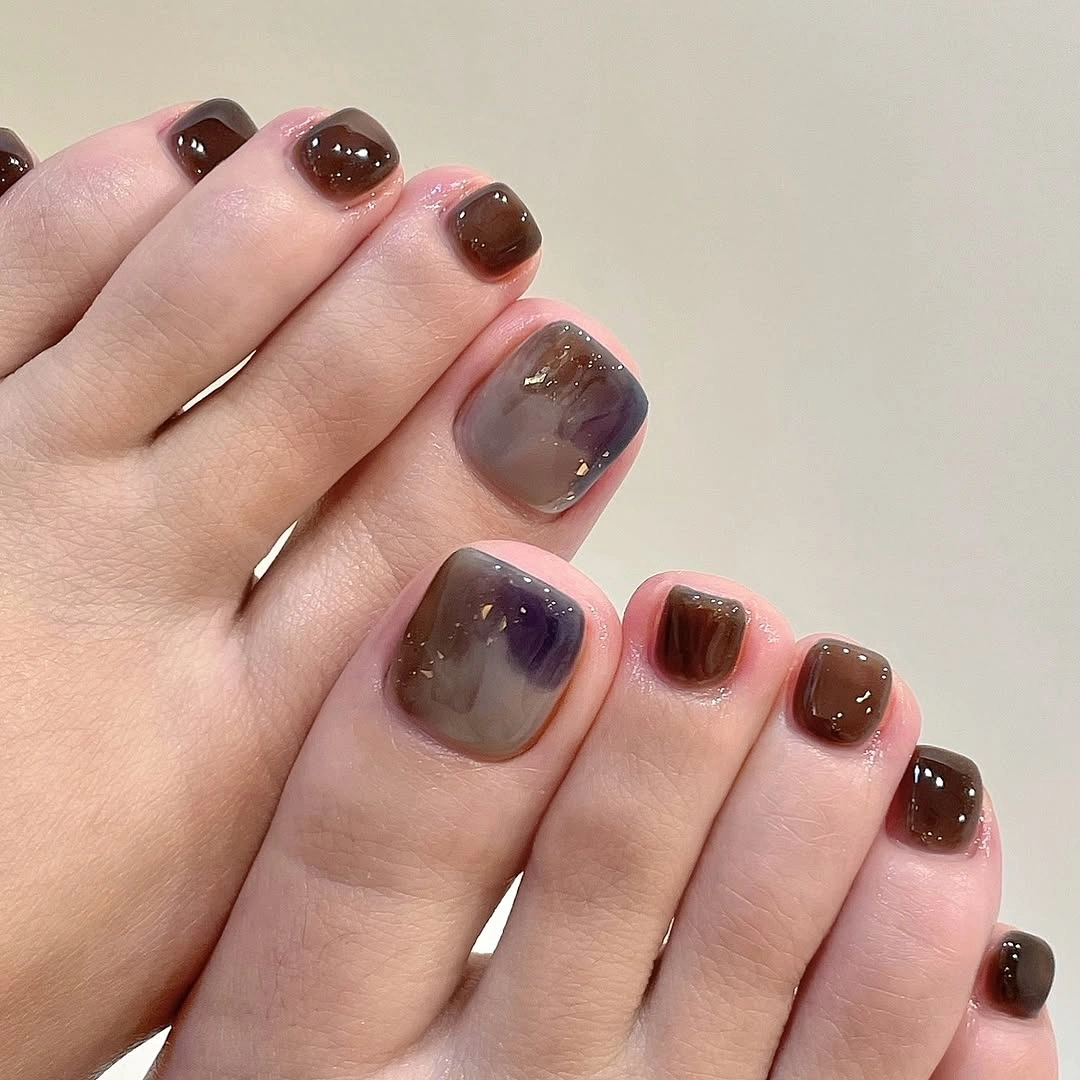 chic fall pedicure ideas 2026 Smoky Marble With Soft Cat Eye Depth