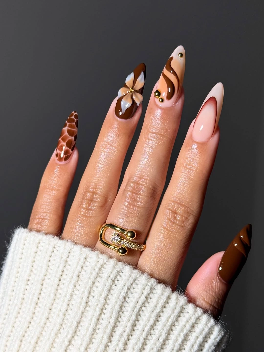 chic september nail art ideas 2026 Chocolate Swirls and Elegant Floral Almond Nails