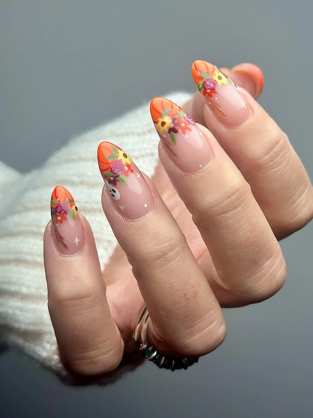 chic september nail art ideas 2026 Autumn Floral French Tips with Pumpkin Tones