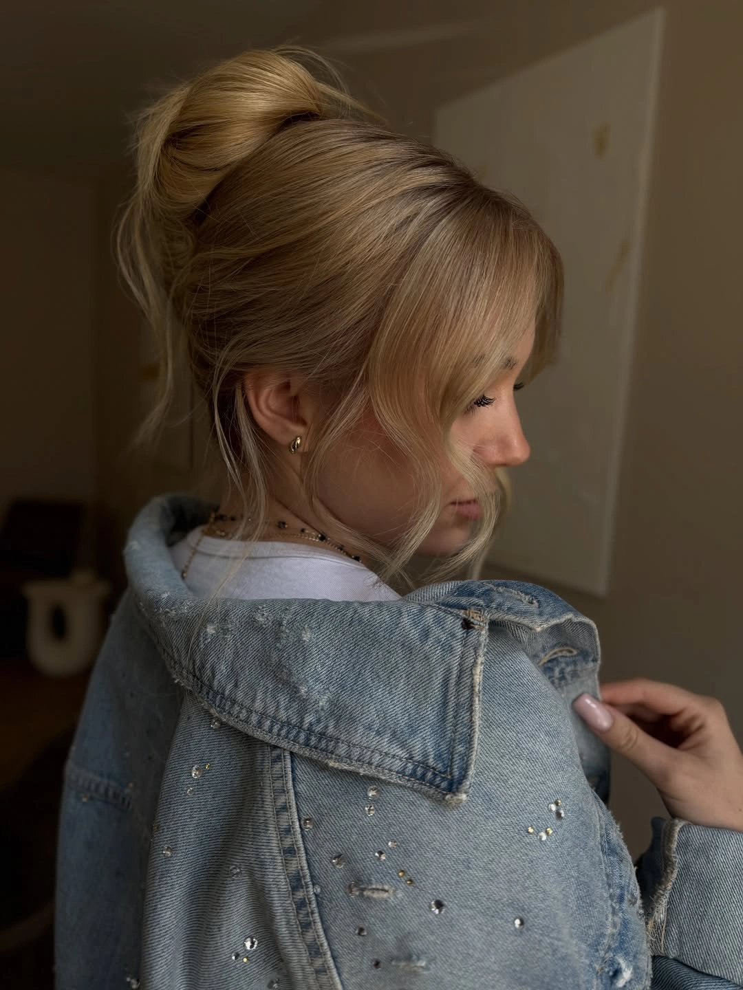 fall hairstyles for long hair 2026 Relaxed High Bun With Wispy Bangs