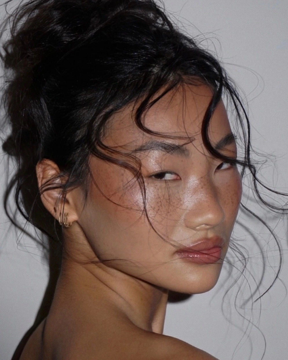 fall hairstyles for office 2026 The Relaxed Updo With Soft Face Framing Curls