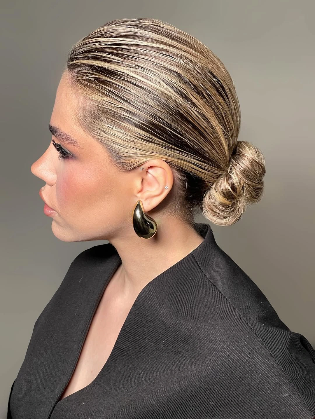 fall hairstyles for short hair 2026 Minimalist Low Bun With High-Shine Precision