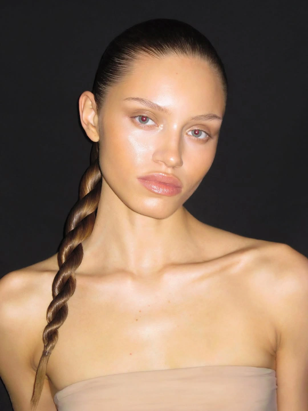 fall hairstyles for wedding guests 2026 Minimalist Twisted Ponytail With High Fashion Appeal