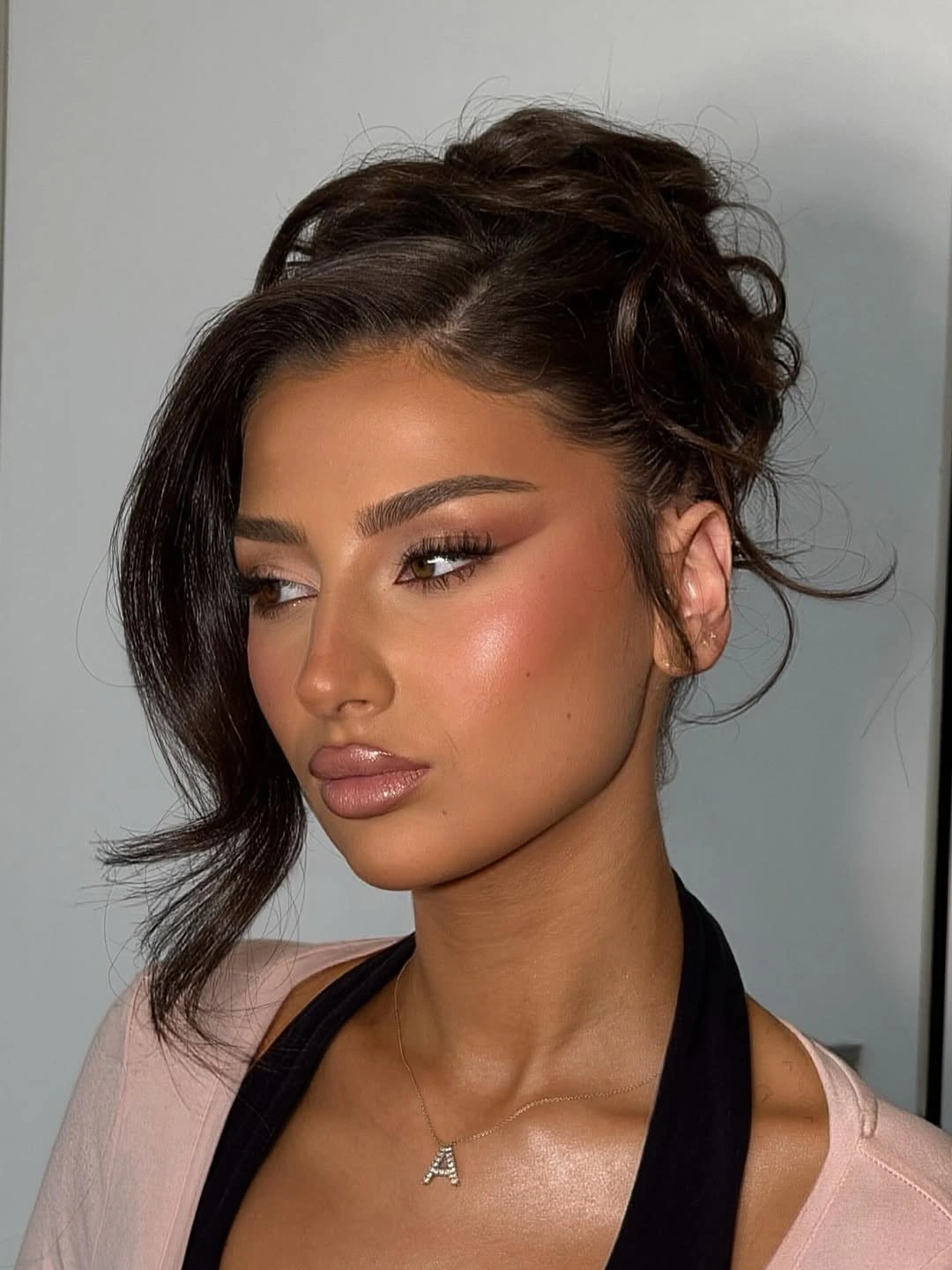 fall hairstyles for wedding guests 2026 Soft Textured Updo With Face Framing Layers
