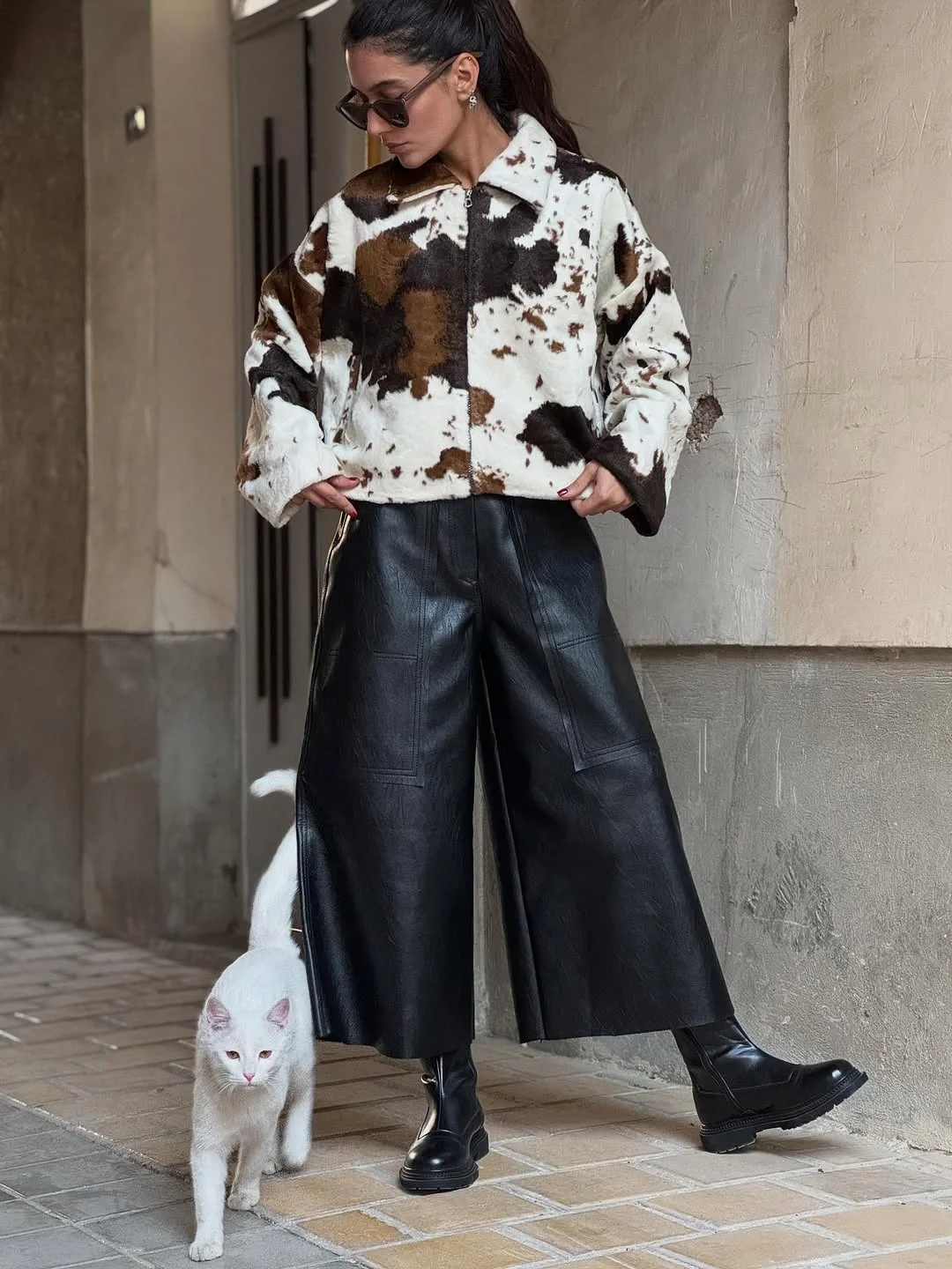 fall outfits with Leather pants 2026 Relaxed Faux Leather Pants With A Statement Cow Print Jacket