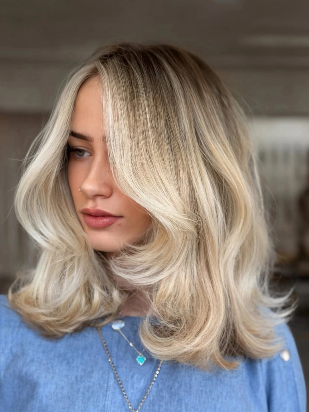 gorgeous beige blond hair color Bright Beige Blonde with Voluminous Curtain Layers