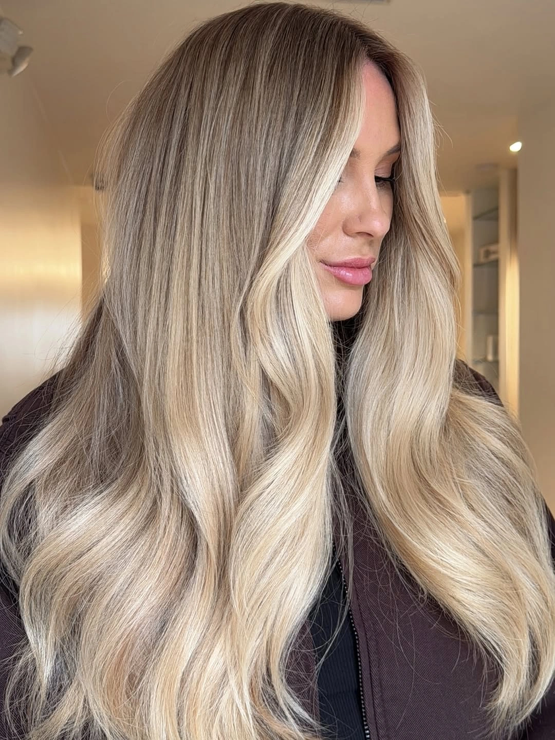 gorgeous beige blond hair color Champagne Beige Waves with a Soft Root Melt