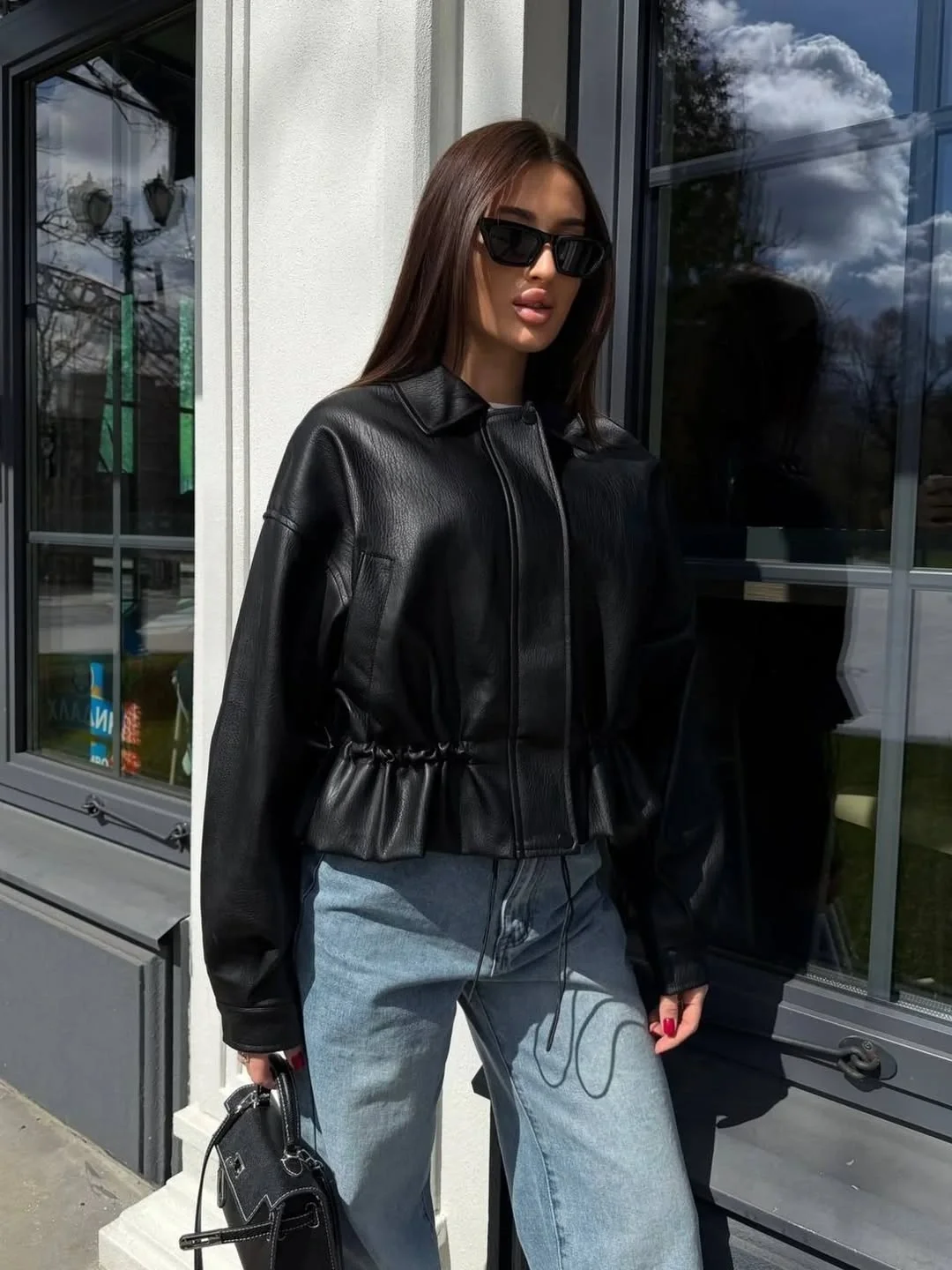 leather jacket outfits women 2026 A Modern Black Jacket That Brings Relaxed Denim Together