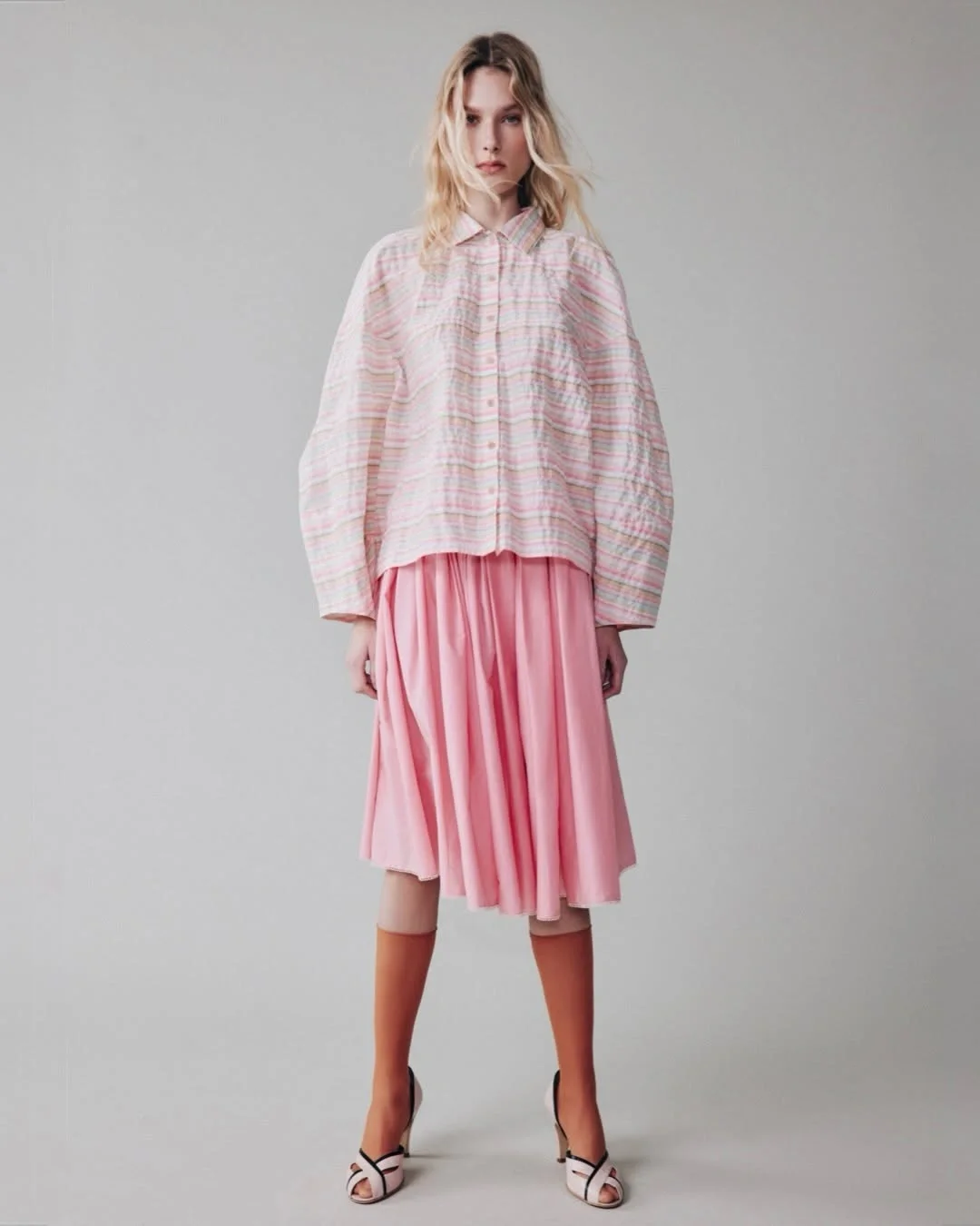 midi skirt fall outfit 2026 Soft Pink Layers Create an Unexpected Autumn Palette