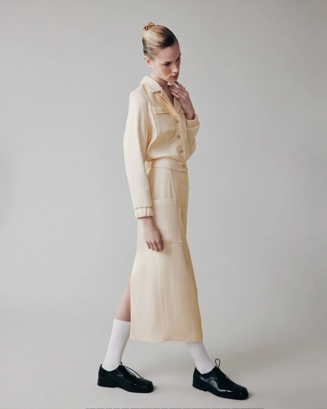 midi skirt fall outfit 2026 Cream Tailoring Gives the Midi Skirt a Quiet Luxury Feel